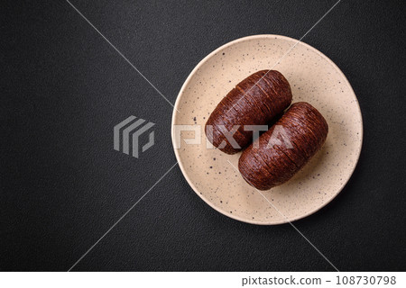 Delicious sweet crispy puff pastry with chocolate filling Delicious sweet crispy puff pastry with chocolate filling 108730798