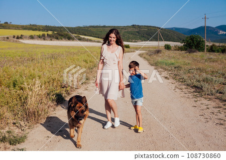 mom with baby and dog walking in nature travel walk vacation 108730860