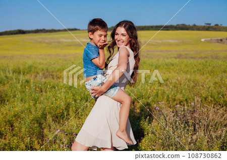 travel walk vacation mom with baby walking in nature 108730862