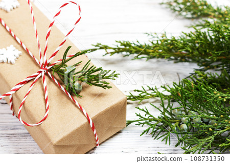 Christmas or New Year background, plain composition made of Xmas decorations and fir branches, flat lay Christmas or New Year background, plain composition made of Xmas decorations and fir branches, flat lay 108731350