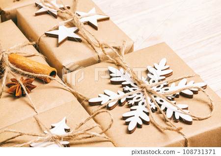 handmade craft christmas gifts or new year rustic presents gifts on wooden background. Toned 108731371