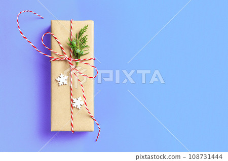 Christmas gift boxein front of blue background with copy space 108731444