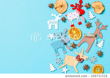 Top view of holiday decorations and toys on blue background. Christmas ornament concept with empty space for your design 108731528