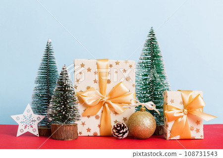 Christmas composition. craft Gift box, small tree, branches and craft DIY decorations on white background. New year concept. Christmas home decoration Flat lay, top view, copy space 108731543
