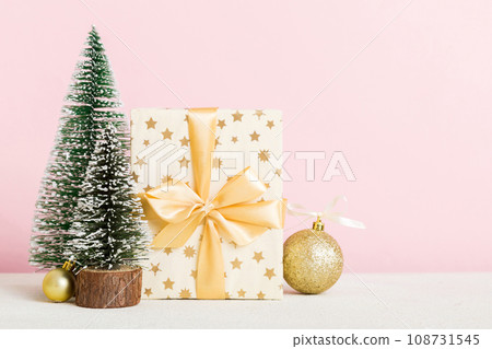 Christmas composition. craft Gift box, small tree, branches and craft DIY decorations on white background. New year concept. Christmas home decoration Flat lay, top view, copy space Christmas composition. craft Gift box, small tree, branches and craft DIY decorations on white background. New year concept. Christmas home decoration Flat lay, top view, copy space 108731545