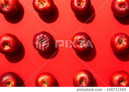 Many red apples on colored background, top view. Autumn pattern with fresh apple above view 108731569
