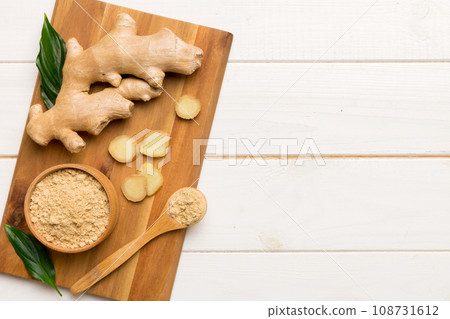 ginger on Cutting board table, top view. Space for text ginger on Cutting board table, top view. Space for text 108731612