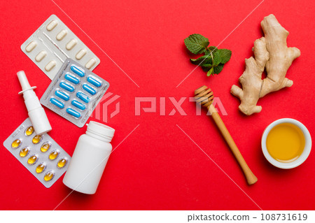 Natural cold and flu home remedies. Natural ingredients for immunity stimulation and viruses protection. top view flat lay Natural cold and flu home remedies. Natural ingredients for immunity stimulation and viruses protection. top view flat lay 108731619