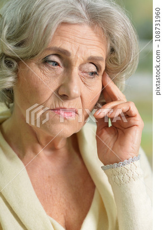 Portrait of sad senior woman with headache 108731960