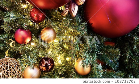 Enlarged photo of a Christmas tree with lots of ornaments Enlarged photo of a Christmas tree with lots of ornaments 108732702