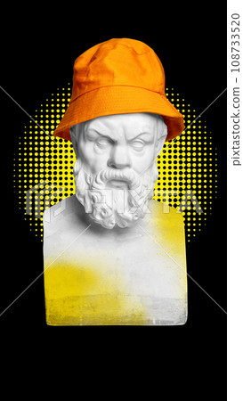 Serious face. Antique statue bust in orange panama against black background with yellow abstract element. Contemporary art collage. 108733520