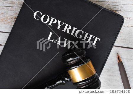 Copyright Law book with gavel background. Law concept Copyright Law book with gavel background. Law concept 108734168