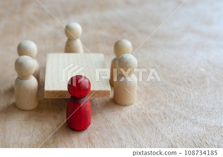 Red wooden figure leading the meeting or discussion. Meeting or discussion concept Red wooden figure leading the meeting or discussion. Meeting or discussion concept 108734185