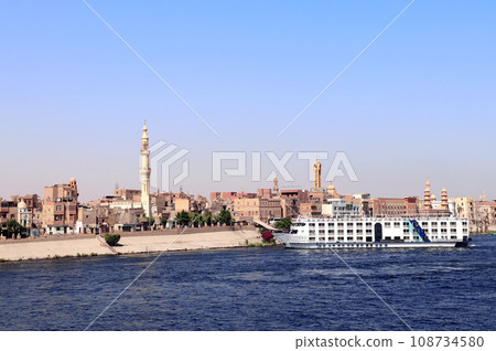 Cruise ship on the Nile river, Egypt, Africa. Luxury Nile Cruise. Summer vacation, relaxing on cruise ships Cruise ship on the Nile river, Egypt, Africa. Luxury Nile Cruise. Summer vacation, relaxing on cruise ships 108734580