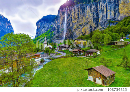 View of Lauterbrunnen valley and Staubbach Fall in Swiss Alps, Switzerland View of Lauterbrunnen valley and Staubbach Fall in Swiss Alps, Switzerland 108734813