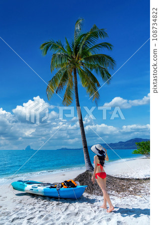 Tourist walking on tropical beach at Koh yao yai island, Thailand. Tourist walking on tropical beach at Koh yao yai island, Thailand. 108734822