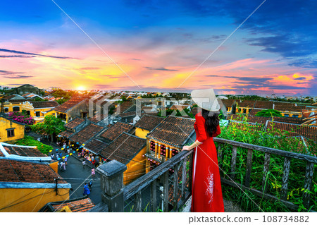 Tourist enjoying sunset on rooftop at Hoi an ancient town, Vietnam. 108734882