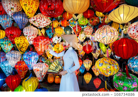 Asian woman wearing vietnam culture traditional and hoi an lanterns at Hoi An ancient town, Vietnam. 108734886