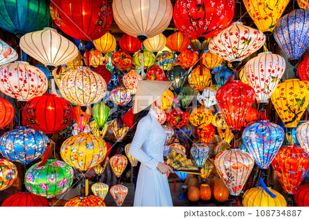 Asian woman wearing vietnam culture traditional and hoi an lanterns at Hoi An ancient town, Vietnam. 108734887