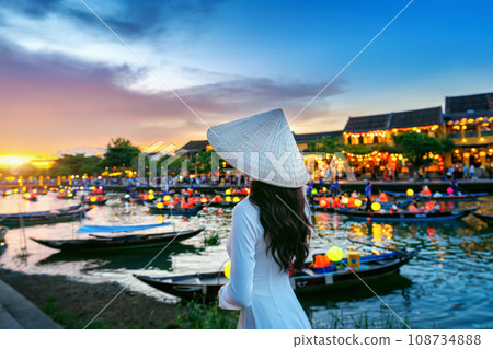 Asian woman wearing vietnam culture traditional at Hoi An ancient town,Hoi an city in Vietnam. 108734888