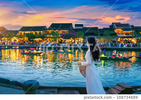 Asian woman wearing vietnam culture traditional at Hoi An ancient town,Hoi an city in Vietnam. 108734889
