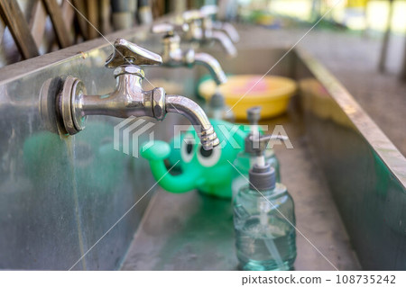 I'm curious about the green elephant in the hand washing area. I'm curious about the green elephant in the hand washing area. 108735242