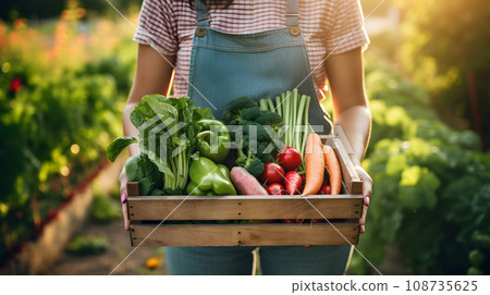 farmer shows in white wooden box the harvest 108735625