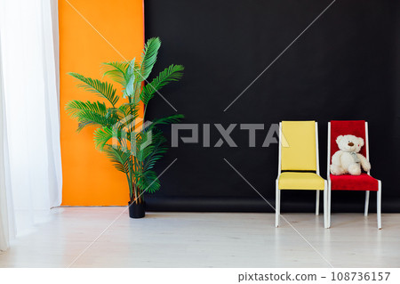 yellow red chair on black background decorative flower yellow red chair on black background decorative flower 108736157