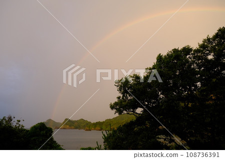 Sunset and a rainbow 108736391