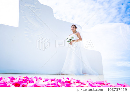 Pre-shoot of the bride with her wedding dress veil dancing Pre-shoot of the bride with her wedding dress veil dancing 108737459
