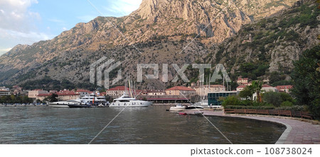 Kotor, Montenegro boats and old town view Kotor, Montenegro boats and old town view 108738024