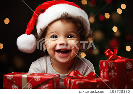 Festive Toddler Delight A Joyful Portrait of a Smiling Toddler in a Santa Hat on Christmas Eve, Against a Bokeh Background. created with Generative AI 108738580