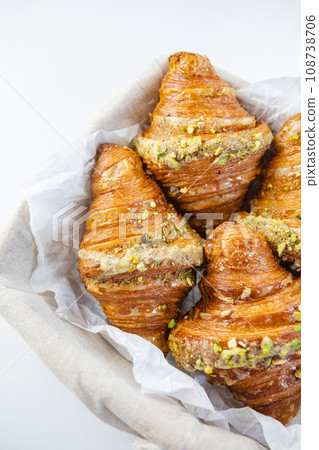 Freshly baked pistachio croissants - a gourmet breakfast treat. Freshly baked pistachio croissants - a gourmet breakfast treat. 108738706