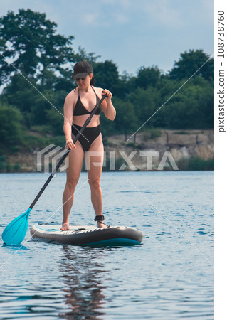 standing woman on supboard standing woman on supboard 108738760