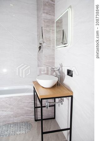 Modern bathroom interior, mirror with LED lighting and washbasin bowl with wooden top, home 108738846