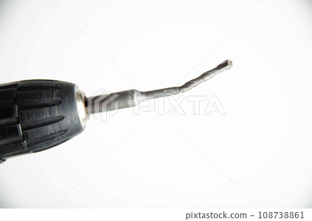 Poor quality broken metal drill on a white background, close-up 108738861