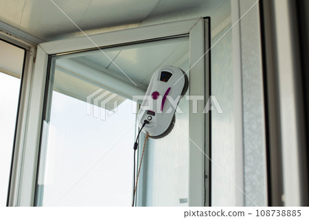 A modern device, a robot window cleaner for cleaning glass from dirt and streaks. A modern device, a robot window cleaner for cleaning glass from dirt and streaks. 108738885