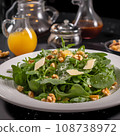Salad with spinach cheese and walnut on white plate Healthy eating concept 108738972