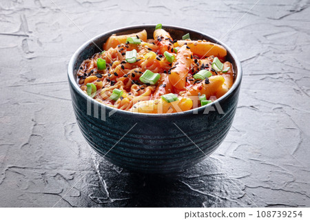 Rabokki, tteokbokki or topokki with ramen, Korean street food, spicy rice cakes Rabokki, tteokbokki or topokki with ramen, Korean street food, spicy rice cakes 108739254