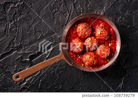 Meatballs. Beef meat balls, overhead flat lay shot in a pan, with tomato sauce Meatballs. Beef meat balls, overhead flat lay shot in a pan, with tomato sauce 108739279