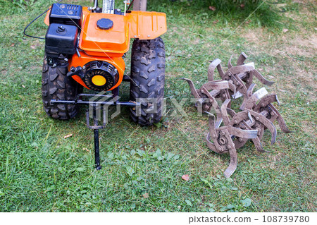 cutters complete with walk-behind tractor for work on the ground. Technique for agriculture. Motor cultivator cutters complete with walk-behind tractor for work on the ground. Technique for agriculture. Motor cultivator 108739780