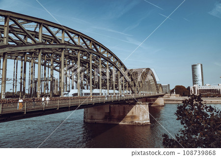 Hohenzollern Bridge on a sunny clear day, view from Cologne Cathedral Hohenzollern Bridge on a sunny clear day, view from Cologne Cathedral 108739868