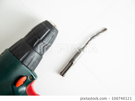Poor quality broken metal drill on a white background, close-up Poor quality broken metal drill on a white background, close-up 108740121