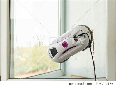 Clean windows safely with a window cleaning robot, close-up 108740166