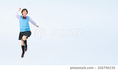 Female student in uniform jumping, cropped full body photo 108740230