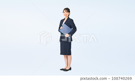 Woman wearing a suit holding a file, cropped full body photo Woman wearing a suit holding a file, cropped full body photo 108740269