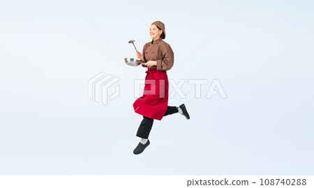 Woman in cooking clothes jumping, cook, restaurant worker, cutout full body photo 108740288