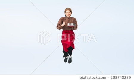 Woman in cooking clothes jumping, cook, restaurant worker, cutout full body photo 108740289