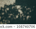 Shadow of a tree reflected on a concrete wall 108740706