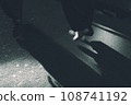 A businessman crossing a pedestrian crossing 108741192